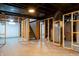 Unfinished basement featuring stud framing, exposed ceiling, and concrete floors at 4547 Farrington Ave, Indianapolis, IN 46201