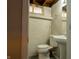 View of small bathroom with a toilet and pedestal sink at 4547 Farrington Ave, Indianapolis, IN 46201