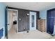 The bedroom has a chalkboard wall, complemented by wooden accents and simple furnishings at 49 Fountain Lake Dr, Greenfield, IN 46140