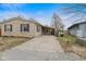 A stone-clad house with a covered parking area and a well-maintained driveway at 49 Fountain Lake Dr, Greenfield, IN 46140
