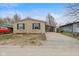 Charming stone-faced home with covered parking and a well-maintained driveway at 49 Fountain Lake Dr, Greenfield, IN 46140