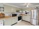 A functional kitchen with well-maintained cabinets and stainless steel appliances at 49 Fountain Lake Dr, Greenfield, IN 46140