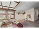 Cozy living room featuring a unique paneled ceiling and ample natural light at 49 Fountain Lake Dr, Greenfield, IN 46140