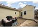 Backyard patio area with outdoor furniture and grill, perfect for relaxing or entertaining at 5252 N College Ave, Indianapolis, IN 46220
