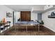 Open concept basement features a ping pong table, wet bar, and seating for entertaining at 5252 N College Ave, Indianapolis, IN 46220