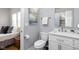 En suite bathroom features a white vanity, toilet, and linen closet at 5252 N College Ave, Indianapolis, IN 46220