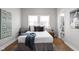 Light and airy bedroom with a walk-in closet has hardwood floors at 5252 N College Ave, Indianapolis, IN 46220