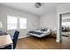 Bedroom with an office space, hardwood floors, and lots of bright, natural light at 5252 N College Ave, Indianapolis, IN 46220