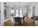 Elegant dining room with stylish table and chairs, open to kitchen, and bright natural light at 5252 N College Ave, Indianapolis, IN 46220