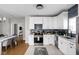 Bright kitchen featuring white cabinetry, stainless steel appliances, and an open layout at 5252 N College Ave, Indianapolis, IN 46220