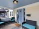 Inviting front porch with comfortable seating, stylish lighting, and a welcoming entrance at 5252 N College Ave, Indianapolis, IN 46220