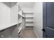 Walk-in closet features built-in shelves and hanging rods for optimal organization at 5252 N College Ave, Indianapolis, IN 46220
