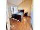 Cozy bedroom with hardwood floors, a vaulted ceiling, and natural light at 5329 Hawks Point Rd, Indianapolis, IN 46226