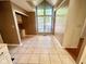 Enjoy this dining area with natural light through a large window and tiled floors for easy cleaning at 5329 Hawks Point Rd, Indianapolis, IN 46226