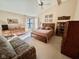 This primary bedroom features a ceiling fan, natural light, and carpeted floors at 5329 Hawks Point Rd, Indianapolis, IN 46226