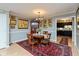 Formal dining room featuring a round table, upholstered chairs, oriental rug, and access to the kitchen at 5333 Thicket Hill Ln, Indianapolis, IN 46226