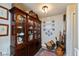 Dining room with dark wood china cabinet and decorations displayed on the wall at 5333 Thicket Hill Ln, Indianapolis, IN 46226