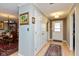 Bright entryway with neutral paint, wood floors, coat closet and views into the formal dining room at 5333 Thicket Hill Ln, Indianapolis, IN 46226