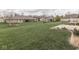 Large backyard featuring a lush lawn and multiple homes with brick exteriors and manicured landscaping at 5524 Coventry Park Way, Indianapolis, IN 46237