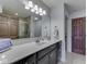 Bathroom featuring a modern vanity, sink and mirror with great lighting at 5524 Coventry Park Way, Indianapolis, IN 46237