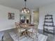Spacious dining room featuring hardwood floors, a round table, and stylish decor for an inviting atmosphere at 5524 Coventry Park Way, Indianapolis, IN 46237