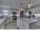 Bright, updated kitchen with granite countertops, stainless steel appliances, and a functional island at 5524 Coventry Park Way, Indianapolis, IN 46237