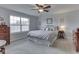 Comfortable bedroom with a large window and soft, neutral decor at 5524 Coventry Park Way, Indianapolis, IN 46237