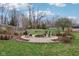 Inviting backyard with a brick patio featuring a fire pit and seating area at 5945 Mcfarland Rd, Indianapolis, IN 46227