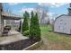 Charming backyard with patio, shed, and mature trees at 5945 Mcfarland Rd, Indianapolis, IN 46227