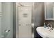 Bathroom featuring a shower with a glass door, modern fixtures, and a stylish sink at 5945 Mcfarland Rd, Indianapolis, IN 46227