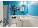 Bright bathroom with colorful wall decor and a stylish vanity at 5945 Mcfarland Rd, Indianapolis, IN 46227