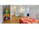bedroom featuring playful decor and an ensuite study area at 5945 Mcfarland Rd, Indianapolis, IN 46227
