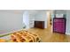 Bedroom with sloped ceilings, hardwood floors and a glimpse into an adjoining room at 5945 Mcfarland Rd, Indianapolis, IN 46227