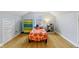 Cozy bedroom featuring unique decor and hardwood floors at 5945 Mcfarland Rd, Indianapolis, IN 46227