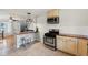 Modern kitchen featuring stainless steel appliances, updated cabinets, and stylish countertops at 5945 Mcfarland Rd, Indianapolis, IN 46227