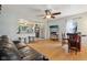 Open living room flowing into kitchen featuring hardwood floors and modern finishes at 5945 Mcfarland Rd, Indianapolis, IN 46227