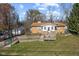 Charming one-story home with a wooden ramp and an attached garage, surrounded by trees at 6436 E Hadley Rd, Mooresville, IN 46158