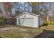 Detached garage with a white siding at 6436 E Hadley Rd, Mooresville, IN 46158