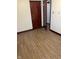 Bedroom with wood-look floors and entryways creates a bright and welcoming atmosphere at 7002 Mclain Dr, Indianapolis, IN 46217