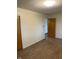 Bedroom with wood-look floors, closet, and access to other rooms provides a comfortable living space at 7002 Mclain Dr, Indianapolis, IN 46217