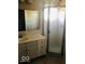 A full bathroom featuring a walk-in shower and a vanity sink at 709 Braugham Rd, Indianapolis, IN 46227