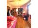 Bright bedroom with hardwood floors, a full closet, and natural light from a window at 709 Braugham Rd, Indianapolis, IN 46227