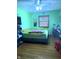 Cozy bedroom featuring a ceiling fan, hardwood floors, and soft, inviting lighting at 709 Braugham Rd, Indianapolis, IN 46227
