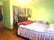 Cozy bedroom with hardwood floors and closet space at 709 Braugham Rd, Indianapolis, IN 46227