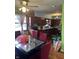 Open dining area with hardwood floors and dark wood cabinets in kitchen at 709 Braugham Rd, Indianapolis, IN 46227