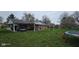 Spacious backyard featuring a trampoline and swingset, perfect for outdoor activities and Gathering fun at 709 Braugham Rd, Indianapolis, IN 46227