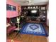 Cozy living room showcases a large entertainment center, dark leather couch, and an accent chair at 709 Braugham Rd, Indianapolis, IN 46227