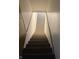 Carpeted stairs with natural lighting at 709 Braugham Rd, Indianapolis, IN 46227