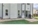 Exterior showcasing a patio with grill, complemented by stone and lush greenery at 716 Bristol Ct, Greenwood, IN 46143