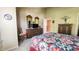 Bedroom with a patchwork quilt, TV on dresser, and view of the hallway at 716 Bristol Ct, Greenwood, IN 46143